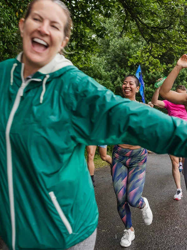 Women running a 5k with big smiles
